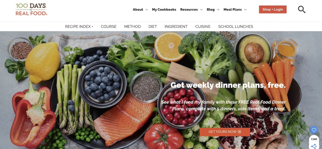 Homepage of 100 Days of Real Food with a hero image of fresh produce and a free weekly dinner plans opt-in offer